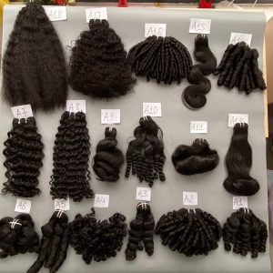 Assortment of Vietnamese black hair extensions in various textures and styles labeled for selection.