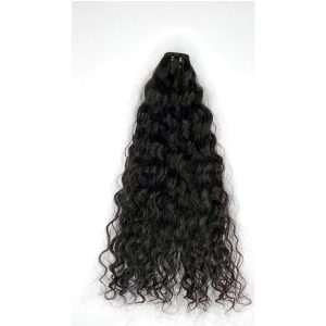 Luxurious Indian deep wave black hair extension spread out on a plain white background.